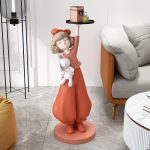Tượng cô gái bưng khay để cạnh sofa phòng khách