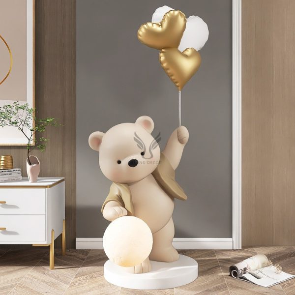 Tượng gấu tâng bóng